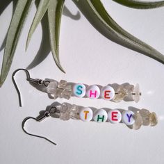 Proudly wear your pronouns on your lobes! White beads with multi-colored letters, & smoky quartz stone chip beads.  Rubber backings included for secure wearing. Stone Chips, Non Binary, Letter Beads, Chip Beads, Bead Earrings, White Beads, Quartz Stone, Smoky Quartz, Multi Colored