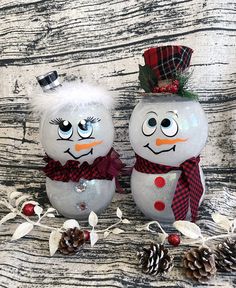 two snowmen are sitting next to each other