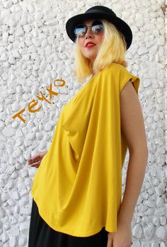 Plus size yellow top made of finest viscose. Oversize blouse with asymmetrical fold in front. Material: 95% viscose, 5% elastane Care instructions: Wash at 30 degrees The model in the picture is size S. Can be made in ALL SIZES. If you have any other specific requirements, do not hesitate to contact me! I DO NOT CHARGE EXTRA MONEY for custom made items. All you need to do is send me your measurements. Below, you will find a table with size references. How to get an accurate measurement: * Chest: Mustard Yellow Top, Evening Tops, Oversize Women, Oversized Blouse, Women Blouse, Yellow Blouse, Yellow Top, Asymmetrical Tops, Mustard Yellow