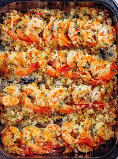 baked shrimp scamps in a baking dish with the title above it reads baked shrimp scamps