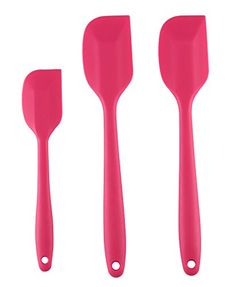 three pink spatulas are shown on a white background and one is in the shape of a spoon