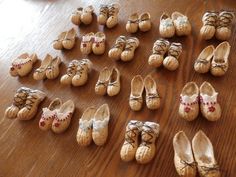 many pairs of shoes are laid out on the floor