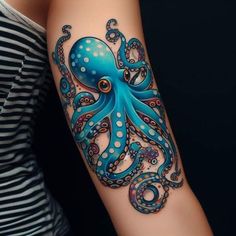 an octopus tattoo on the arm with blue and white dots around its tentacles, is shown