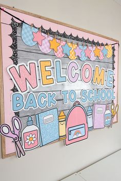 a welcome back to school sign hanging on the side of a wall in a room