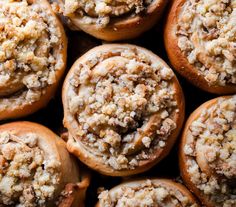 freshly baked muffins with crumbled toppings are shown in close up