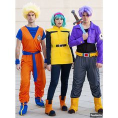 three people in costumes standing next to each other