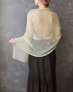 This Knit Linen Shawl Wrap stands out as an essential accessory, seamlessly blending elegance with versatility for both special occasions and everyday wear. Wrap yourself in the opulent comfort of this generously sized, natural, and soft shawl. Pair it with a flowing dress or layer it over a jacket or coat, achieving a perfect fusion of fashion and comfort. This knitted linen shawl is a versatile piece that allows you to transform your look effortlessly. Cover your shoulders for a sophisticated Soft Shawl, Summer Bridesmaids, Flowing Dress, Grace To You, Women Scarf, Linen Yarn, Cozy Scarf, Flowing Dresses, Knitted Baby Blankets