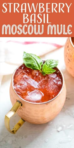 a strawberry basil moscow mule in a copper mug with mint garnish on top