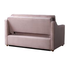 a pink couch sitting on top of a white floor