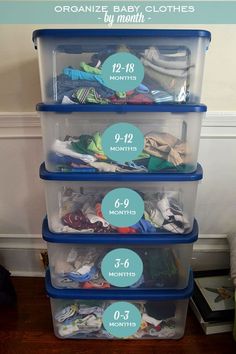 a stack of plastic containers with labels on the top and bottom that read organize baby clothes by month