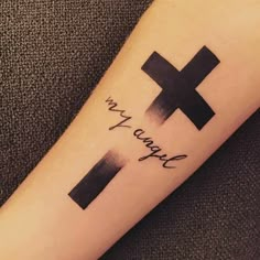 a cross tattoo on the arm that says, i am enough to be loved by someone else