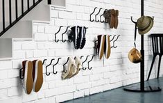 there are many shoes hanging on the wall