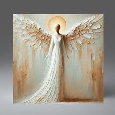 an angel painting with white wings on a gray background and the sun shining through it