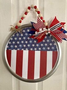 a patriotic wreath hanging on the front door