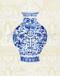 a blue and white vase sitting on top of a table