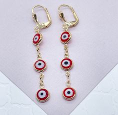 "Christmas season is a great period to give gifts. Enjoy a special collection just having you in mind. It's time to celebrate. Time to give, time to receive. Time to spread love. 18k Gold Filled Red Evil Eye Dangling Earring Our Etsy store was developed to help you find the most unique styles of modern designs, always looking for elegance and market trends. Here you will find ways to better make your jewelry through quality, seeking harmony, exclusivity and impeccable finish. Find many more styl Cheap Red Evil Eye Jewelry, Handmade Festive Jewelry For Valentine's Day, Red Jewelry For Christmas Celebration, Red Jewelry For Holiday Jewelry Making, Festive New Year Dangle Jewelry, Red Hypoallergenic Jewelry For Party, Red Hypoallergenic Party Jewelry, Holiday Red Adjustable Jewelry, Hypoallergenic Red Jewelry For Parties