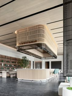 the interior of a modern office building with wood and metal accents on the ceiling, along with white chairs and tables