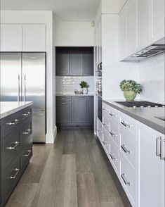 the instagram page shows an image of a kitchen with white cabinets and gray counter tops