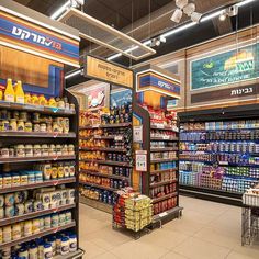 a grocery store filled with lots of different types of food and drinks on shelves next to each other