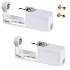 two white electrical plugs with gold hardware on each side and one in the middle