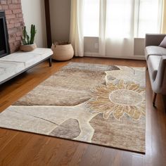 a living room with a couch, chair and rug in front of a fire place