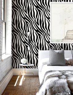 a zebra print wallpaper in a bedroom