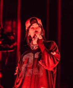 a man standing on stage with his mouth open