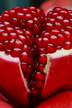 the pomegranate is cut in half and ready to be picked from the tree