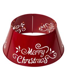 a red lamp shade with merry christmas written on it's side and white lettering