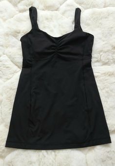 Lululemon Athletic Tank Top w/ Shelf Bra Size: 6 Color: Black Pad Pockets (no pads included) Lightly worn. Great condition. Please see photos for measurements. FS0251 Vintage Lululemon, Bra Tank Top, Desired Reality, Gym Shirt, Style Box, Tank Top Bras, Hair Rings, Shelf Bra, Harp