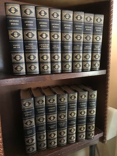 many books are stacked on the shelf in front of each other