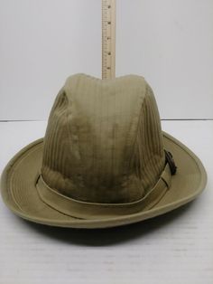 Country Gentleman Hat Vtg/Htf Beige Woven. Pre-owned in very good condition. Material is woven and lined. Does not say size. I measured my head round of 21" and fit my head. Looked up chart and found the measurement is 6-5/8. No tag that shows what material made of. Very nice hat ready for your outfit. Ready to ship. Vintage Wide Brim Solid Color Hat, Vintage Solid Color Wide Brim Hat, Vintage Curved Brim Hat For Travel, Vintage Adjustable Fedora In Solid Color, Vintage Brimmed Travel Hat, Vintage Adjustable Fedora, Vintage Adjustable Solid Fedora, Vintage Beige Wide Brim Fedora, Vintage Beige Travel Hat