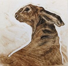 a drawing of a brown rabbit on a white background