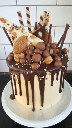 there is a cake with chocolate and ice cream on the top that has waffles in it