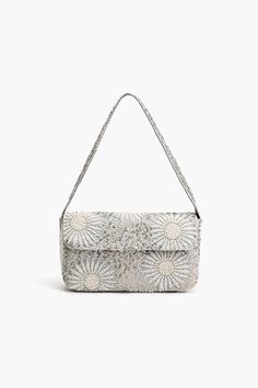 Hand beaded Small Shoulder Bag Fully Embellished in White Foliage Pattern Fully Lined Interior with Zip Pocket Embellished Shoulder Strap Magnetic Button Closure Size: 10" x 5.5" x 2" Handmade by Artisans The Ivory Petal Frostwork Shoulder Bag is an exquisite accessory that exudes elegance and sophistication. Crafted w Luxury Beaded Beige Shoulder Bag, Small Beaded Bag, Beige Beaded Shoulder Bag, Artisan Clothing, Beaded Shoulder Bag, Beaded Embellishments, Leopard Bag, Tambour Embroidery, Floral Purse