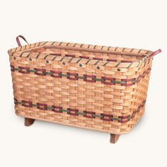 a woven basket sitting on top of a wooden stand