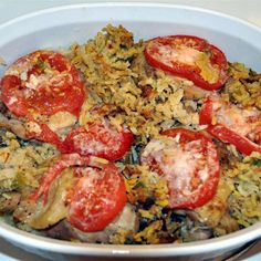 a white bowl filled with rice and tomatoes