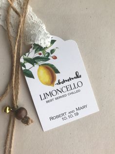 the label for limoonicello is attached to a string