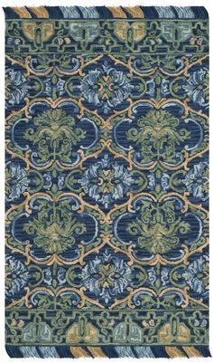 a blue and green rug with an intricate design