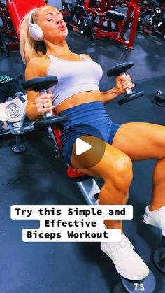 a woman sitting on top of a bench in a gym