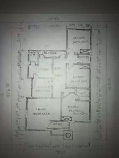 a drawing of a floor plan for a house in the process of being drawn by someone