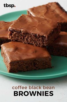 three pieces of chocolate cake on a green plate with one slice cut out and the other half eaten