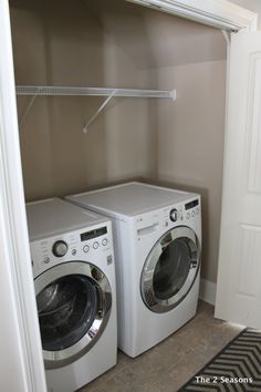 a washer and dryer are in the closet