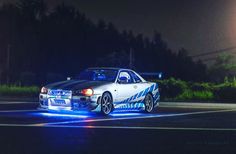 a police car is parked on the street at night