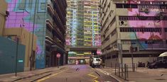 an empty city street with tall buildings and graffiti on the side of it's walls