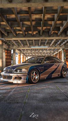 a car that is parked under a bridge