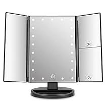 a mirror that is on top of a black stand in front of a white background