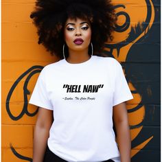 This fashion-forward, unisex cotton T-shirt is sure to make a (stylish) statement. Featuring an instantly recognizable "Hell Naw" print, it is perfect for those who want to make a bold statement with their wardrobe. Express yourself with this unique and comfortable T-shirt in classic white or black. Edgy Short Sleeve T-shirt With Funny Print, Edgy T-shirt With Funny Print And Short Sleeves, Funny Print Crew Neck T-shirt For Streetwear, Edgy T-shirt With Funny Print For Streetwear, Edgy Funny Print T-shirt For Streetwear, Text Print Tops In Ring-spun Cotton For Streetwear, Black Hip Hop T-shirt With Funny Print, Edgy White T-shirt With Text Print, Edgy Slogan T-shirt With Relaxed Fit