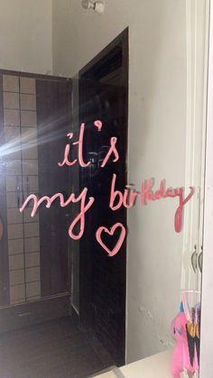 the reflection of someone's birthday cake in a bathroom mirror that says it's my birthday