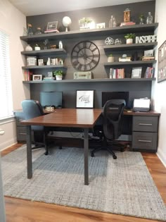 an office with a desk, chair and bookcase on the wall next to it